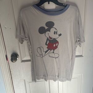 White Disney shirt with blue collar that has Mickey Mouse